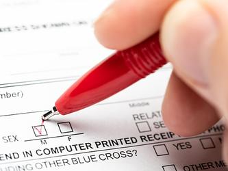 Person filling in official form